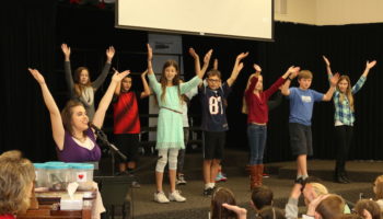 Students serve on the worship team as part of Service Club.